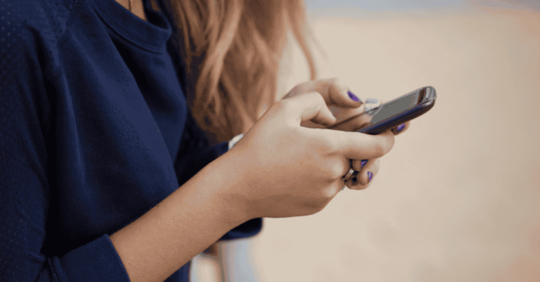 girl-holding-a-phone-1200x627-1024x535.png